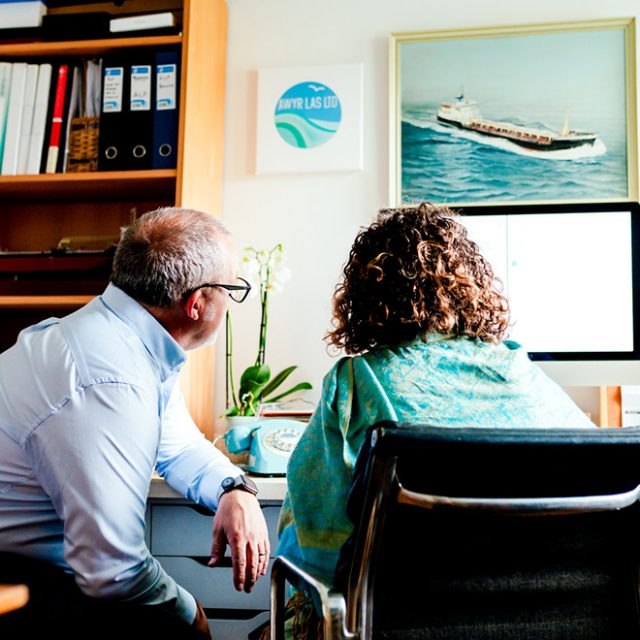 Jacqs and John working at the computer